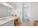 Bright bathroom with a large vanity, ample lighting, and a separate toilet and shower area at 3990 Wesley Chapel Rd, Marietta, GA 30062