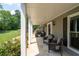 Relaxing covered porch features comfortable wicker furniture, offering the perfect outdoor retreat at 3990 Wesley Chapel Rd, Marietta, GA 30062