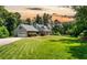 Charming home featuring a well-manicured lawn, gray siding, and a welcoming front porch at 3990 Wesley Chapel Rd, Marietta, GA 30062