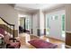 Elegant foyer with hardwood floors, classic staircase, and ample natural light at 3990 Wesley Chapel Rd, Marietta, GA 30062