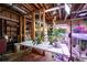 Hobby room featuring tables, shelving, and lighting, ideal for gardening or crafting activities at 3990 Wesley Chapel Rd, Marietta, GA 30062
