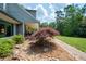 Serene landscape design, complete with mulched beds, shrubbery and a stone walkway at 3990 Wesley Chapel Rd, Marietta, GA 30062