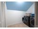 Well-equipped laundry room with a modern washer and dryer set and ample storage space at 3990 Wesley Chapel Rd, Marietta, GA 30062