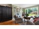 Inviting living area with hardwood floors, accent wall, and backyard views at 3990 Wesley Chapel Rd, Marietta, GA 30062