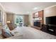 Spacious living room featuring a brick fireplace, cozy seating, and neutral decor at 3990 Wesley Chapel Rd, Marietta, GA 30062