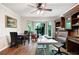 Well-lit office space with built-in shelving, hardwood floors, and a large bay window at 3990 Wesley Chapel Rd, Marietta, GA 30062