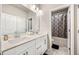 Bright bathroom features a double sink vanity with white cabinets and a shower-tub combo at 4776 Highside Way, Smyrna, GA 30082