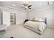 Large bedroom with neutral carpet, ensuite bathroom, and comfortable queen bed at 4776 Highside Way, Smyrna, GA 30082