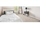 Well-lit bedroom features a neutral color scheme, plush carpet, and a minimalist design at 4776 Highside Way, Smyrna, GA 30082