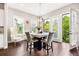 Light-filled dining room with modern furnishings and a door leading to a balcony at 4776 Highside Way, Smyrna, GA 30082