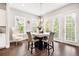 Dining room with chandelier, modern furnishings, and beautiful outdoor view at 4776 Highside Way, Smyrna, GA 30082