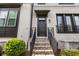 Inviting entrance to townhome with brick steps and decorative iron railing at 4776 Highside Way, Smyrna, GA 30082