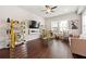 Modern living room with hardwood floors, decorative shelving, and a cozy fireplace at 4776 Highside Way, Smyrna, GA 30082