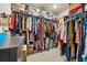 Spacious walk-in closet with an abundance of hanging storage and built-in shelving at 4776 Highside Way, Smyrna, GA 30082