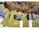 Bird's eye view of homes with well-manicured lawns and neatly arranged driveways in a suburban setting at 6675 Princeton Park Ct, Lithonia, GA 30058