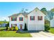 Charming two-story home with a well-manicured lawn and attached two-car garage at 6675 Princeton Park Ct, Lithonia, GA 30058