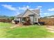 Well-maintained backyard with patio, lawn, and house exterior at 7820 Longview Dr, Cumming, GA 30041