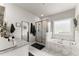 Bathroom with soaking tub, glass enclosed shower and double vanity at 7820 Longview Dr, Cumming, GA 30041