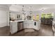 Bright kitchen with an island sink, stainless steel appliances, and convenient counter space at 7820 Longview Dr, Cumming, GA 30041