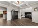 Spacious living room with tall ceilings, dark hardwood floors, and decorative furniture for comfortable living at 7820 Longview Dr, Cumming, GA 30041
