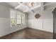 Bright living room with coffered ceilings, wainscoting, and modern floors creating a comfortable and stylish space at 7820 Longview Dr, Cumming, GA 30041