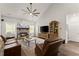 Inviting living room with brick fireplace, hardwood floors, ceiling fan, and comfortable seating at 7820 Longview Dr, Cumming, GA 30041