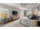 Spacious main bedroom with sitting area, ceiling fan and natural light at 7820 Longview Dr, Cumming, GA 30041