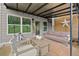 Covered patio area with comfortable seating, string lights, and stylish decor at 7820 Longview Dr, Cumming, GA 30041