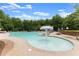 A community pool with ample seating and a splash area for children at 7820 Longview Dr, Cumming, GA 30041