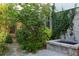 Landscaped backyard with stone fountain, a garden, and privacy landscaping at 2196 Niles Ne Pl, Atlanta, GA 30324