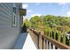 Outdoor balcony with brown wooden railing overlooking the surrounding green trees at 2196 Niles Ne Pl, Atlanta, GA 30324