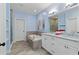 Modern bathroom with a soaking tub, tiled floors, and double sink vanity at 2196 Niles Ne Pl, Atlanta, GA 30324