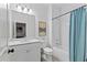Bright bathroom featuring white subway tile, a vanity and a bathtub with shower at 2196 Niles Ne Pl, Atlanta, GA 30324