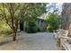 Landscaped courtyard with gravel, seating, and lush greenery around the home at 2196 Niles Ne Pl, Atlanta, GA 30324