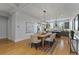 Open-concept dining room with hardwood floors, connecting seamlessly to the modern kitchen and living spaces at 2196 Niles Ne Pl, Atlanta, GA 30324