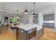 Spacious kitchen with a marble island, stainless steel appliances, and an open view to the dining and living area at 2196 Niles Ne Pl, Atlanta, GA 30324