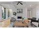 Inviting living room with fireplace, hardwood floors, coffered ceilings, and a view of the staircase at 2196 Niles Ne Pl, Atlanta, GA 30324