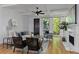 Cozy living room with a fireplace, comfortable seating, and views of the outdoors through large windows at 2196 Niles Ne Pl, Atlanta, GA 30324