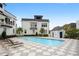 Relaxing pool area featuring lounge chairs, modern homes, and checkered tile patio at 2196 Niles Ne Pl, Atlanta, GA 30324