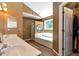 Bathroom featuring a jacuzzi tub, walk in shower, double sink and a walk-in closet at 2621 Garland Way, Duluth, GA 30096