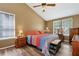 Spacious bedroom featuring a vaulted ceiling, fan and natural light at 2621 Garland Way, Duluth, GA 30096