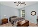 Bedroom with wood dresser, wood chest, an accent mirror and a single window at 2621 Garland Way, Duluth, GA 30096