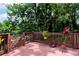A nice back deck with wood railings is a perfect place for entertaining at 2621 Garland Way, Duluth, GA 30096
