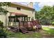 Exterior view showing a deck that overlooks the backyard and a screened in porch at 2621 Garland Way, Duluth, GA 30096