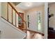 Bright foyer with hardwood floors, a staircase, and a classic front door at 2621 Garland Way, Duluth, GA 30096
