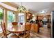 Eat-in kitchen features wood cabinets, stainless steel appliances, and a breakfast nook with natural light at 2621 Garland Way, Duluth, GA 30096