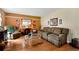 Cozy living room with hardwood floors, comfortable seating, and bright accents at 2621 Garland Way, Duluth, GA 30096