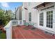 Back deck and entry with table and chair, overlooking the yard at 3460 Drayton Manor Run, Lawrenceville, GA 30046