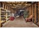 Unfinished basement with exposed beams and insulation offering plenty of potential storage and customization options at 3460 Drayton Manor Run, Lawrenceville, GA 30046