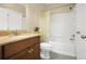 Cozy bathroom with a shower, a vanity featuring a marble countertop, and a toilet that is ready for use at 3460 Drayton Manor Run, Lawrenceville, GA 30046